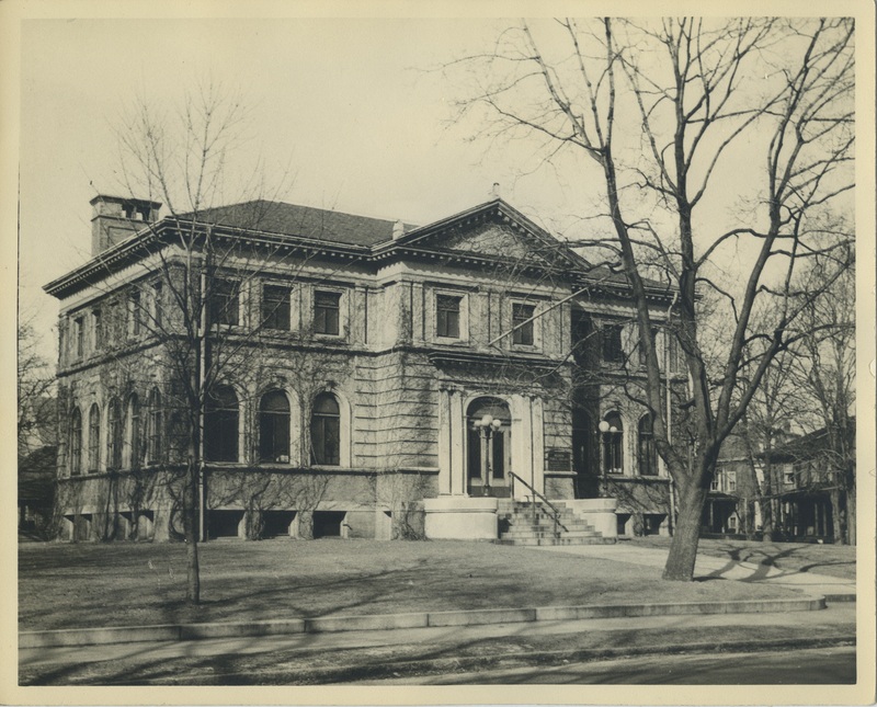 A sepia photograph of the library front and its original entrance