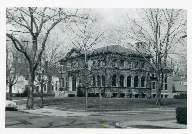 The library seen through bare trees from the corner of Lake Avenue