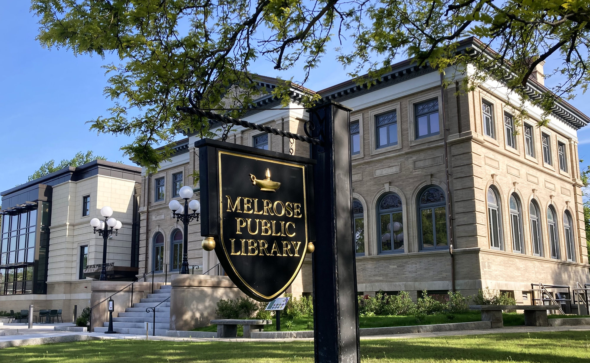 The Melrose Public Library on West Emerson Street, with its black and gold sign out front